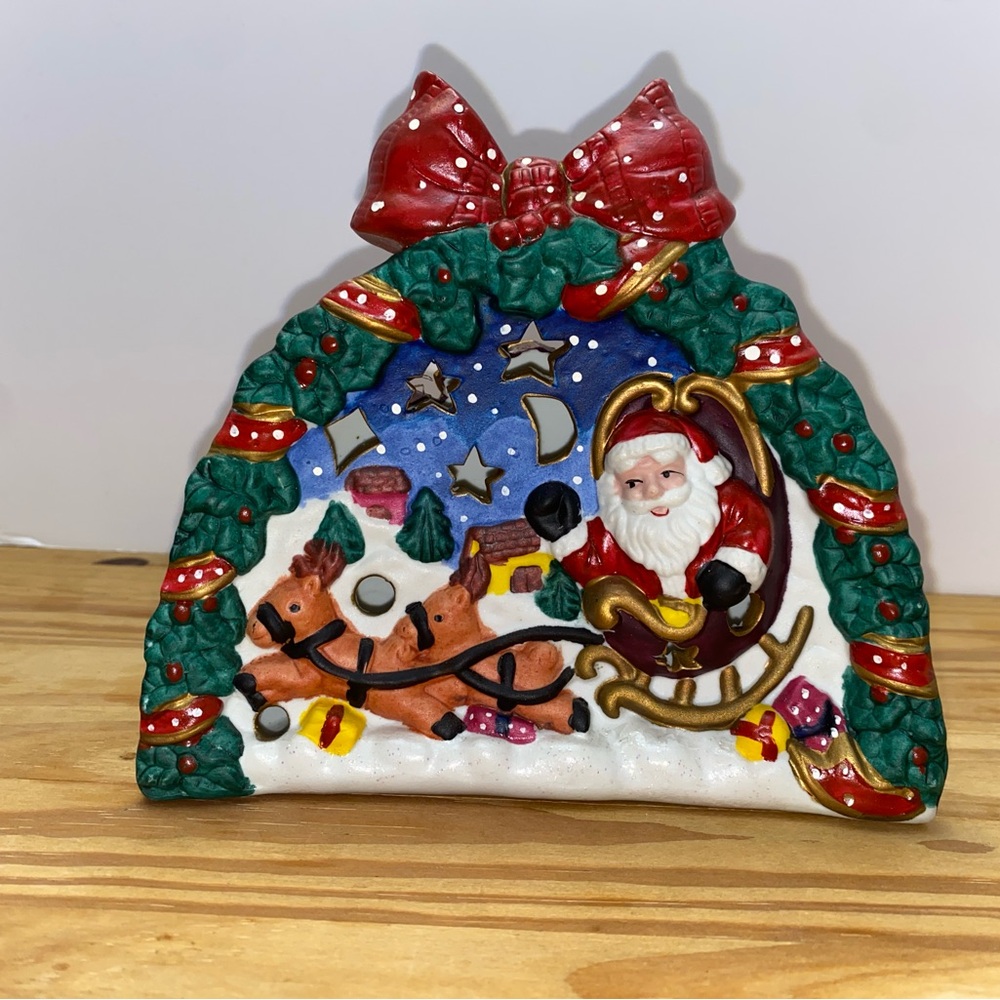 ceramic Santa Claus candle holder.